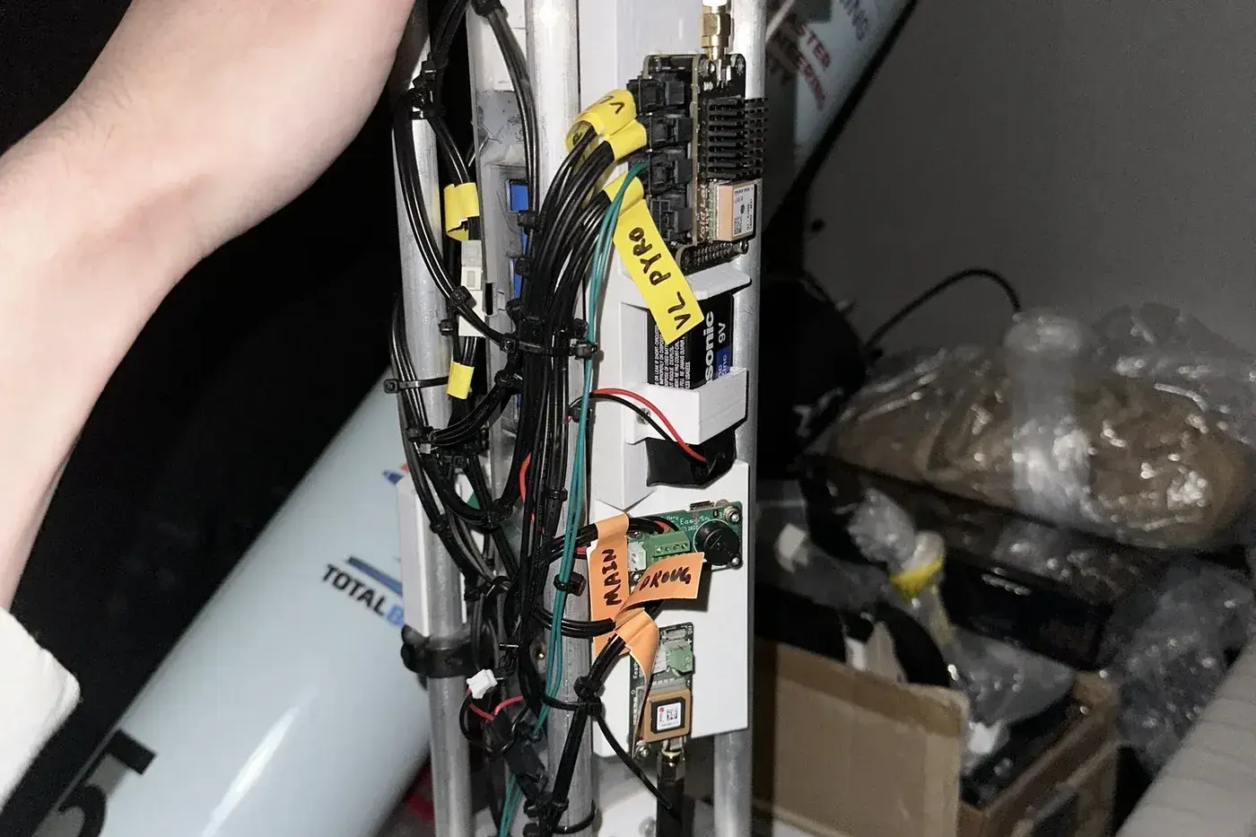 The Luminis avionics sled wired for dual-deploy recovery, VL pyro and main/drogue channels labeled on the harness.